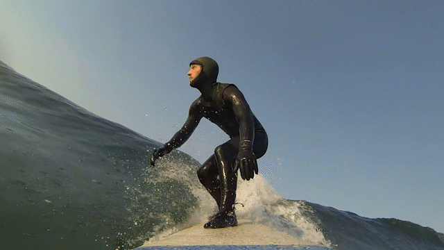 surfer balancing on wave