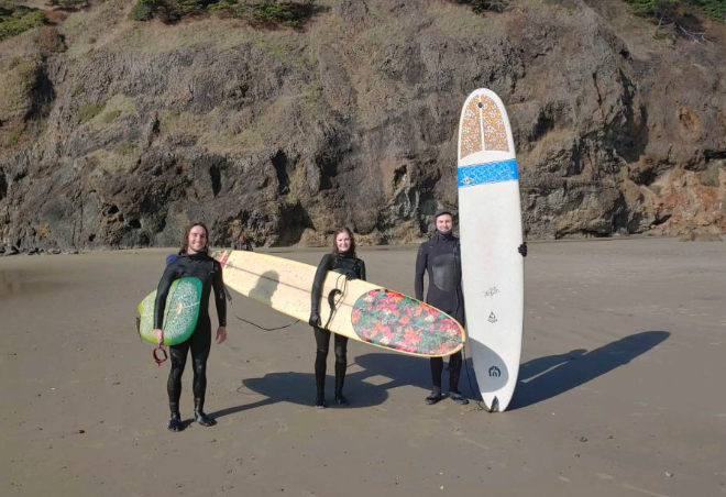 surfers with longboards